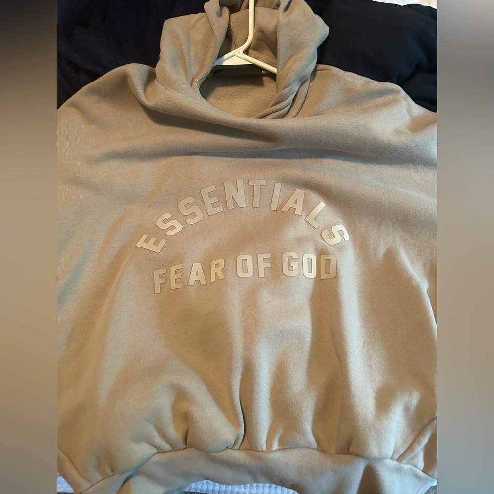 Beige Essentials Hoodie.
